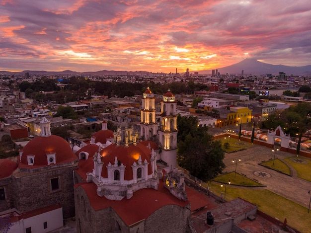 Puebla at dramatic evening sunset aerial drone shot of city center in puebla de zaragoza puebla