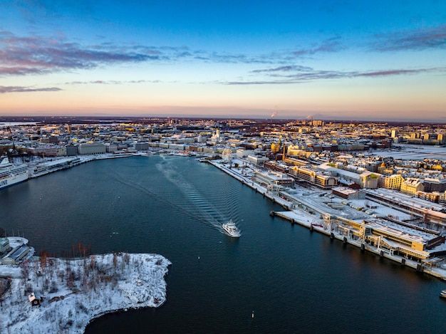 Ferry leaving Helsinki south harbor winter sunset in Finland 01