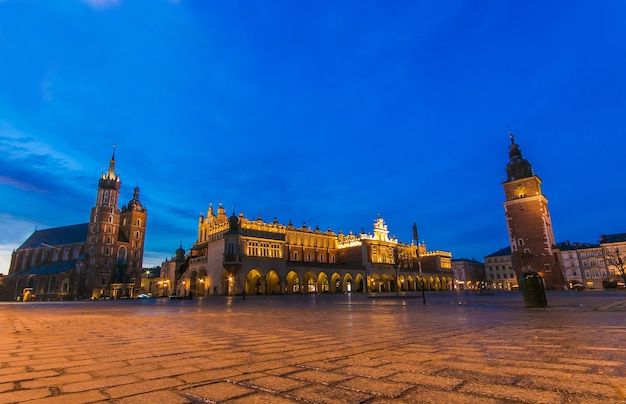 Illuminated building against blue sky at dusk in the center of krakow city poland