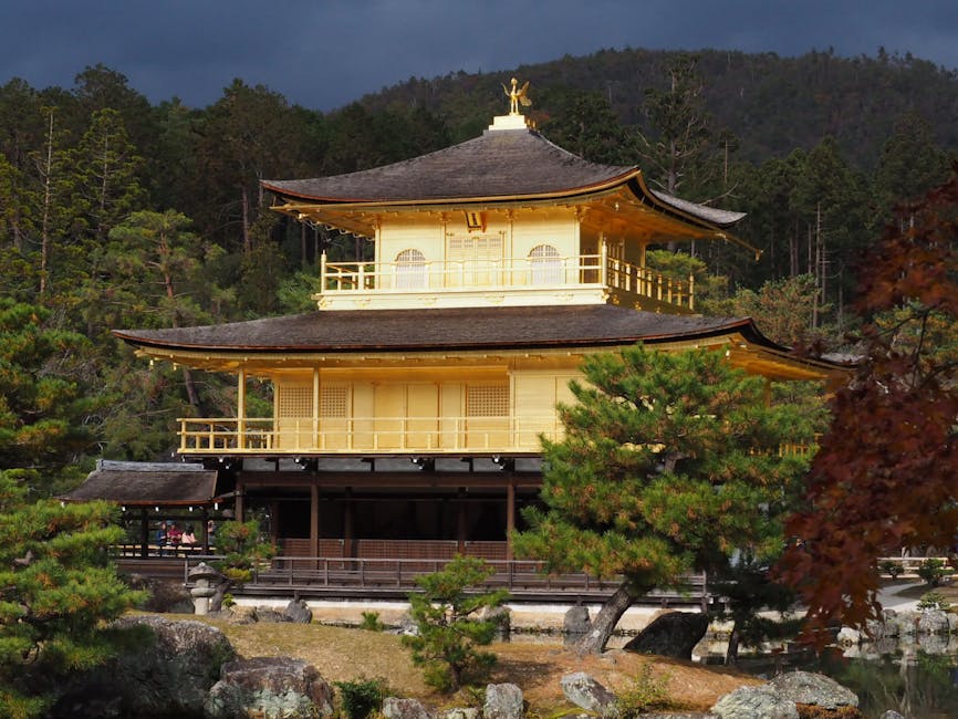 Stunning view of Kinkaku-ji Golden Pavilion amidst lush greenery in Kyoto, Japan.