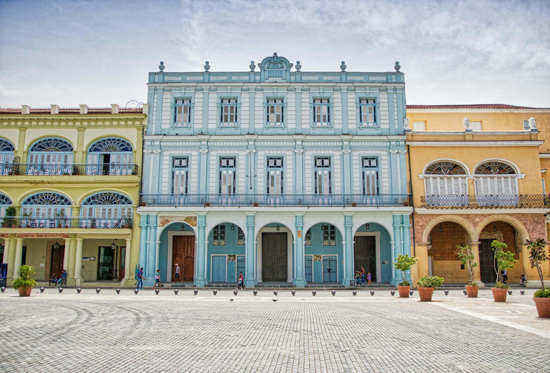 Historic colonial buildings in vibrant Havana, showcasing colorful facades.