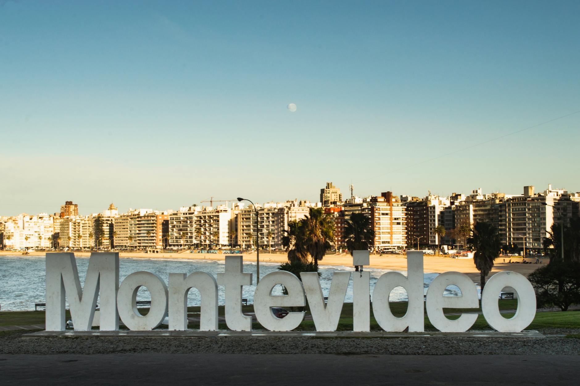 Montevideo landmark sign with city skyline and beach view, capturing Uruguay's iconic coastal urban setting.