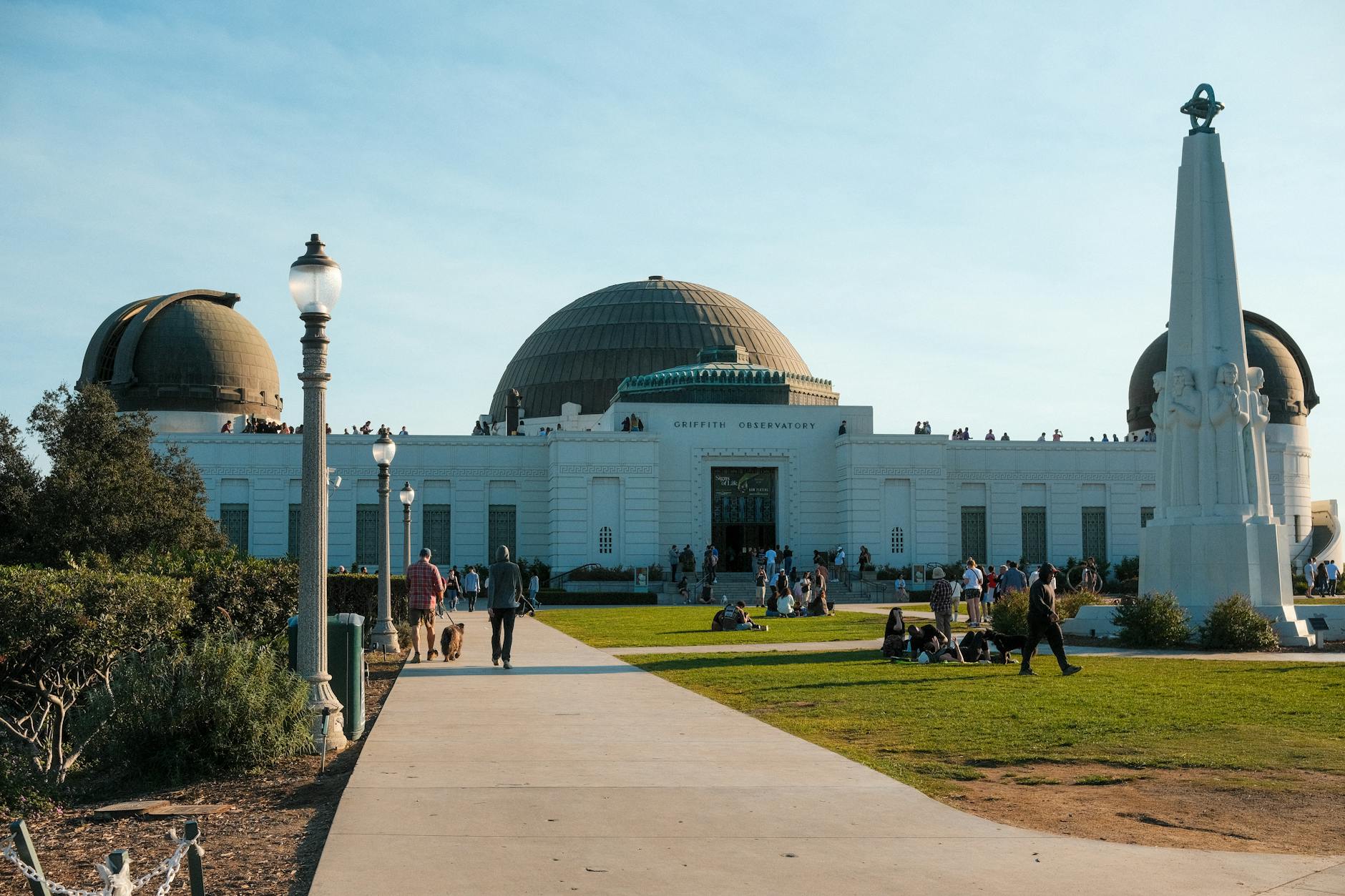 Griffith Observatory in Los Angeles on a sunny day with visitors enjoying the landmark.