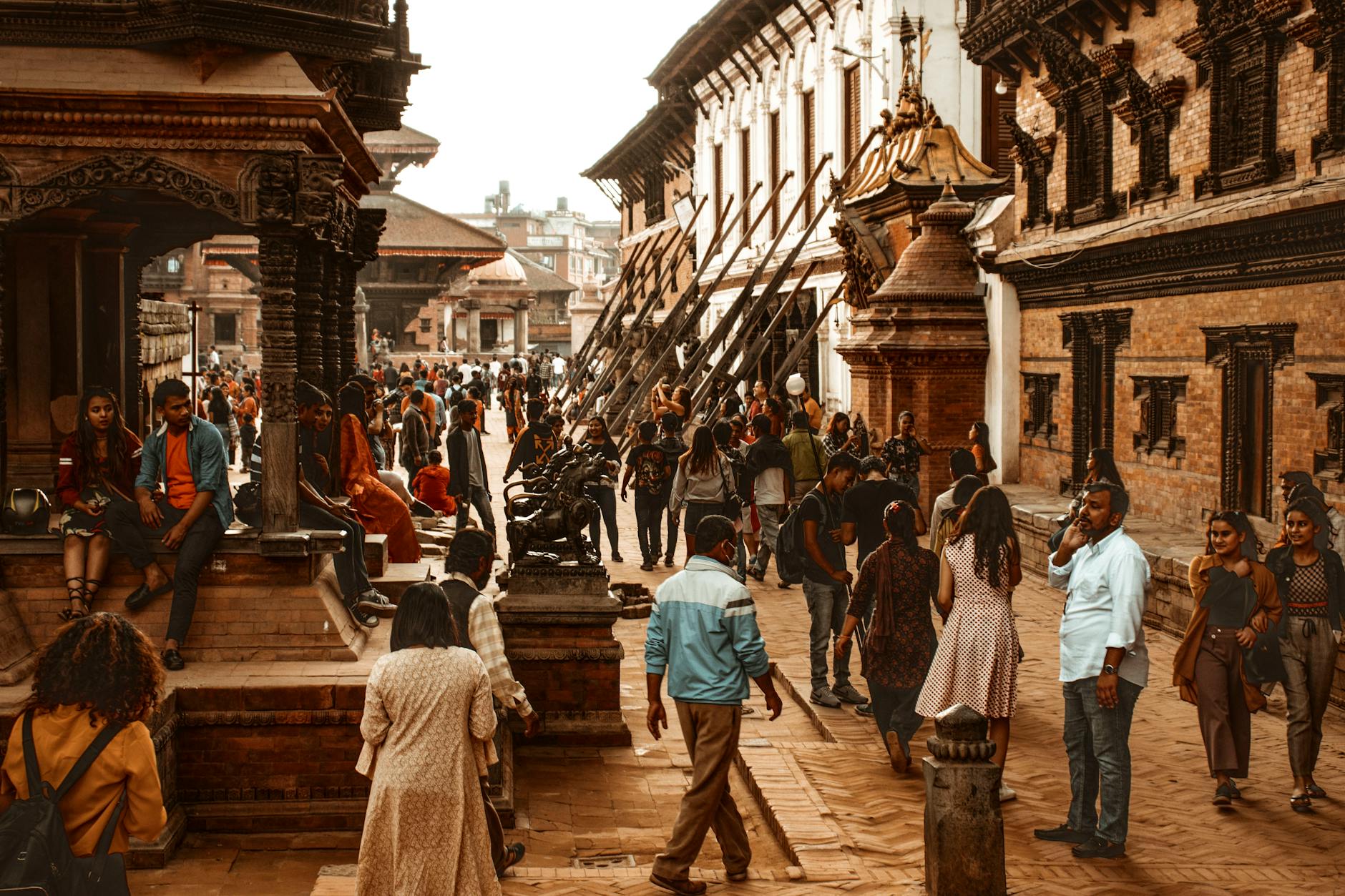 Vibrant street scene in Kathmandu, Nepal showcasing historical architecture and a diverse crowd.