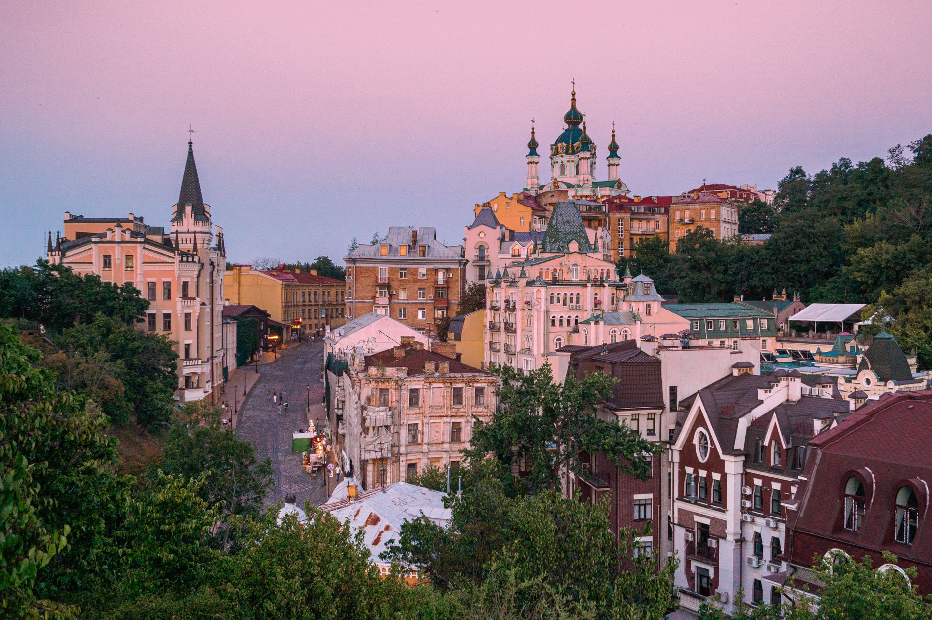 Beautiful view of Kyiv's historic Andriivskyi Descent with stunning sunset colors.