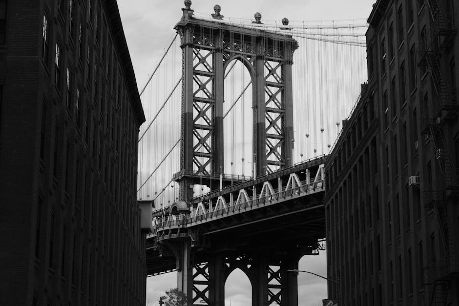 Captivating black and white photo of the Manhattan Bridge viewed from Dumbo, New York City.