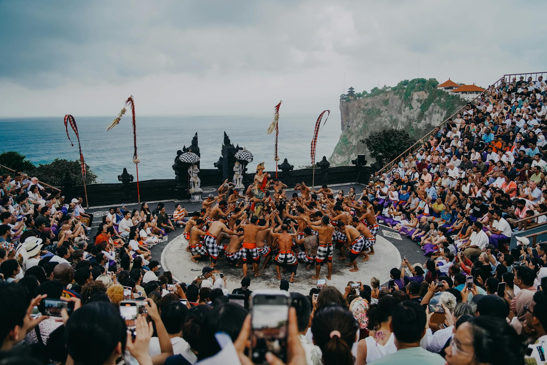 Bali's iconic Kecak dance performed at an open-air amphitheater overlooking the ocean.