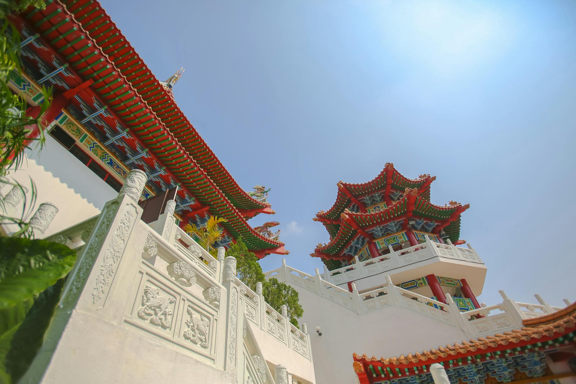 Stunning view of Thean Hou Temple's traditional architecture under a clear blue sky in Kuala Lumpur, Malaysia.