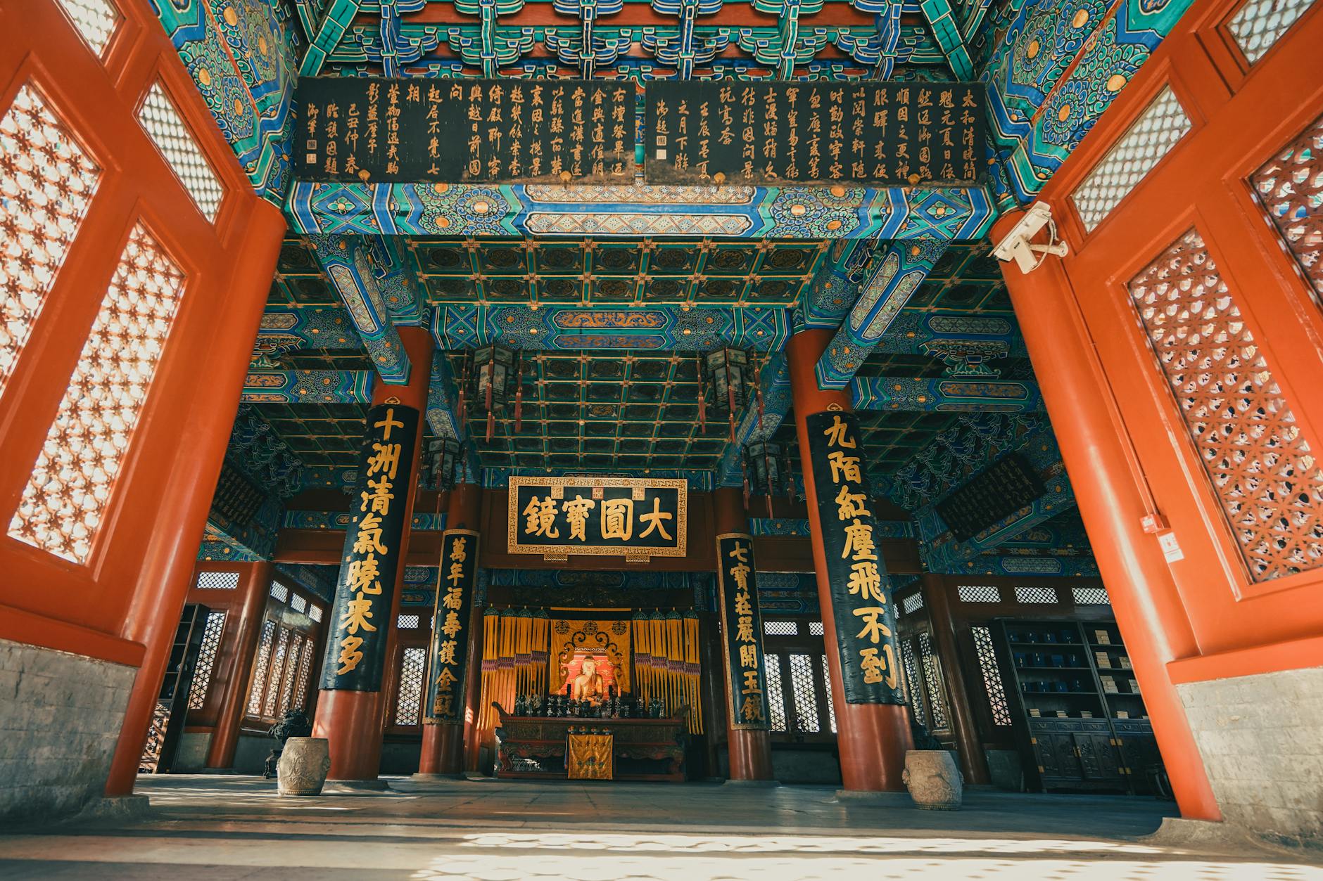 Beautifully ornate Chinese temple interior showcasing intricate designs and vibrant colors.