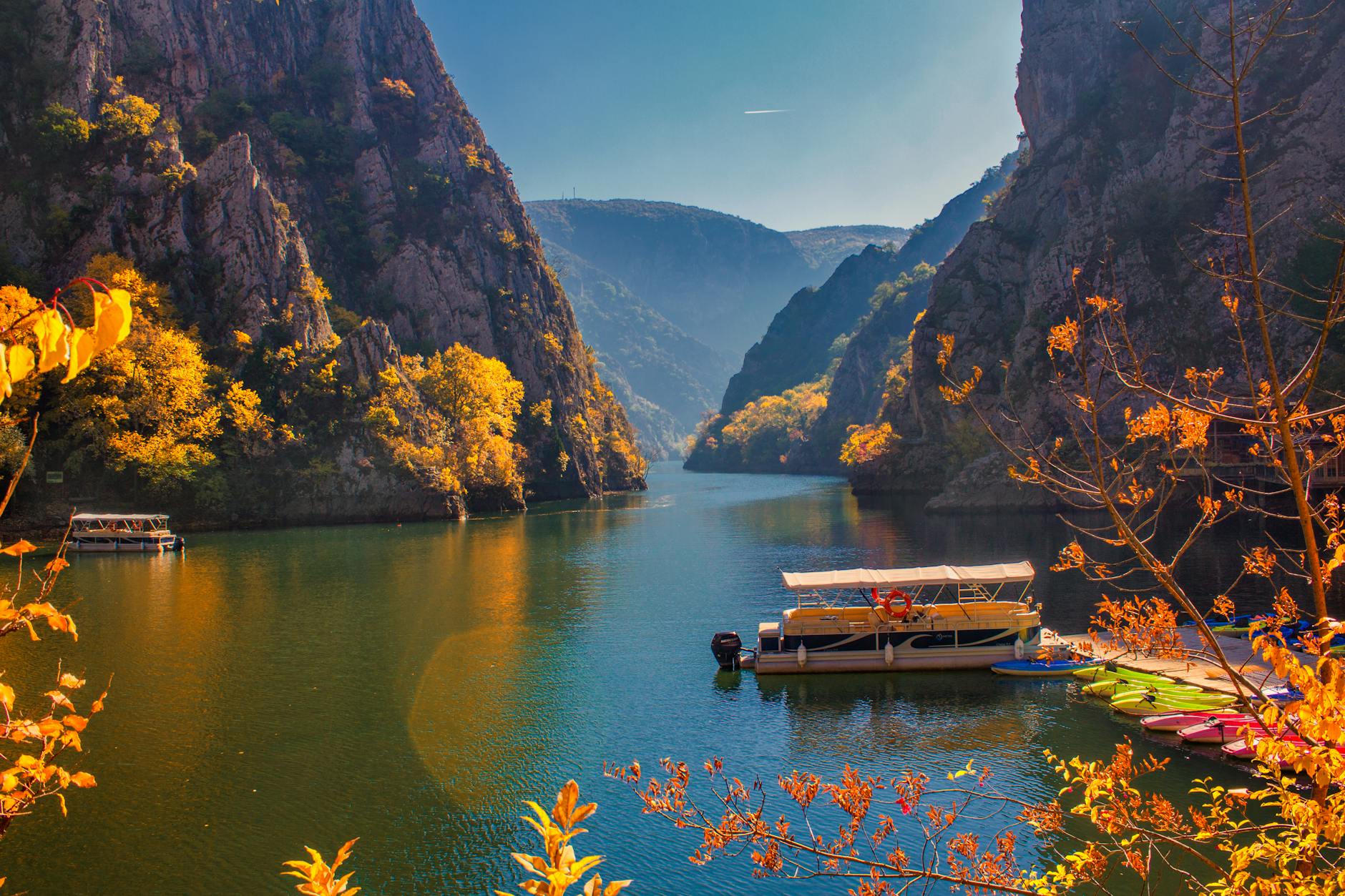 Explore the stunning autumn landscapes of Matka Canyon with vibrant foliage and serene waters.