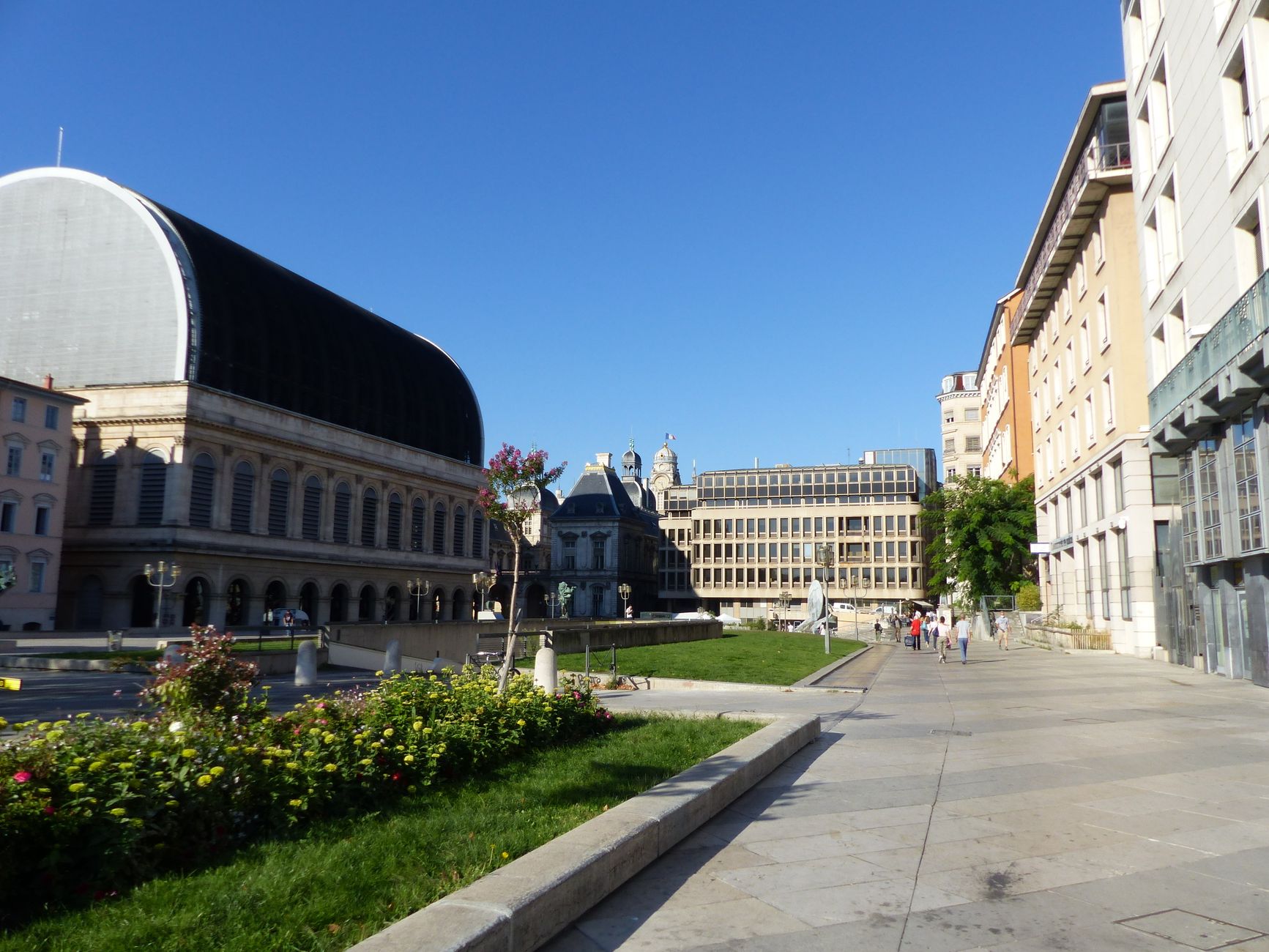 Exterior of aged Opera House and classic styled building located on square against cloudless blue sky in Lyon