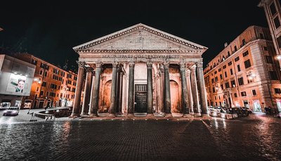Captivating night photography of the ancient Pantheon in Rome, showcasing its grand architecture.