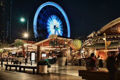 Night view of the illuminated ferris wheel at Asiatique Riverfront in Bangkok, Thailand.