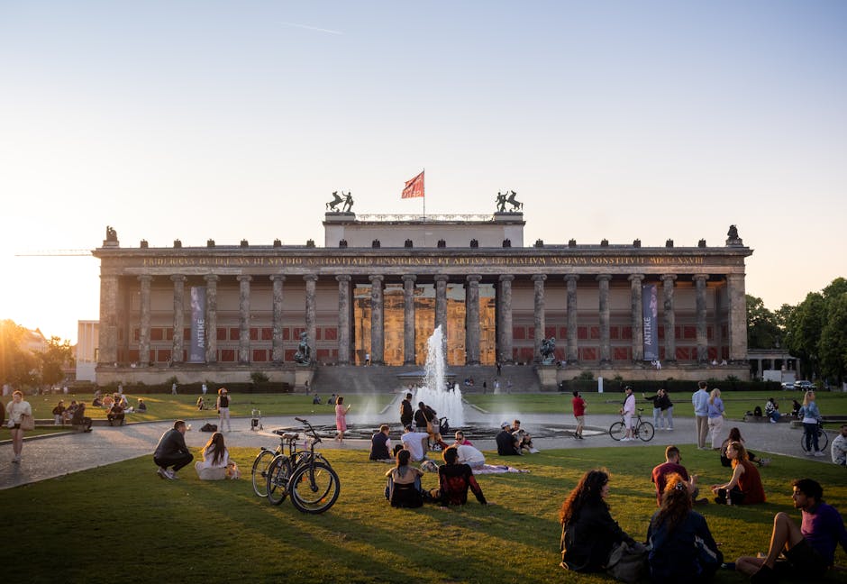 People enjoying a sunny day at Berlin's Altes Museum with a dynamic outdoor vibe.