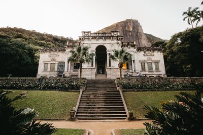 Exterior view of the historic mansion at Parque Lage, a tourist attraction in Rio de Janeiro, Brazil.
