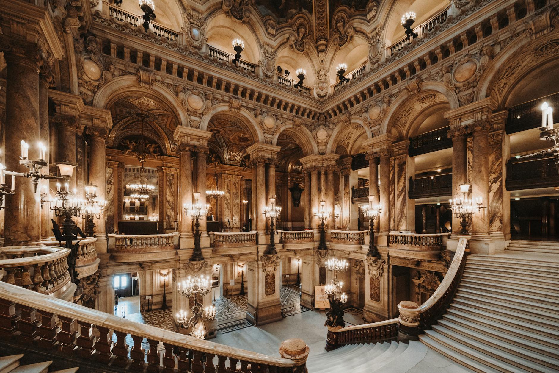 Stunning baroque architecture inside Paris's renowned Palais Garnier, an iconic landmark.