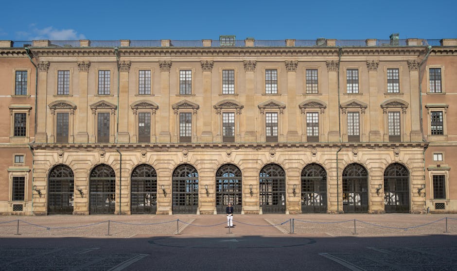 The Royal Palace in Stockholm, Sweden seen on a sunny day with a solitary guard.