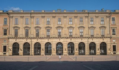 The Royal Palace in Stockholm, Sweden seen on a sunny day with a solitary guard.