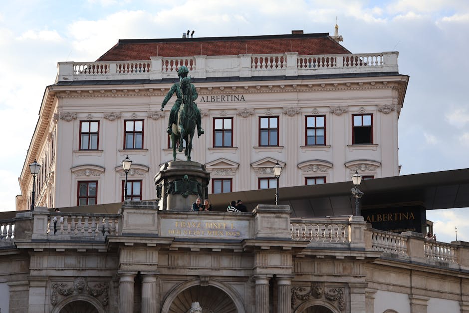 View of the Albertina Museum and Franz Joseph I statue in Vienna, Austria.