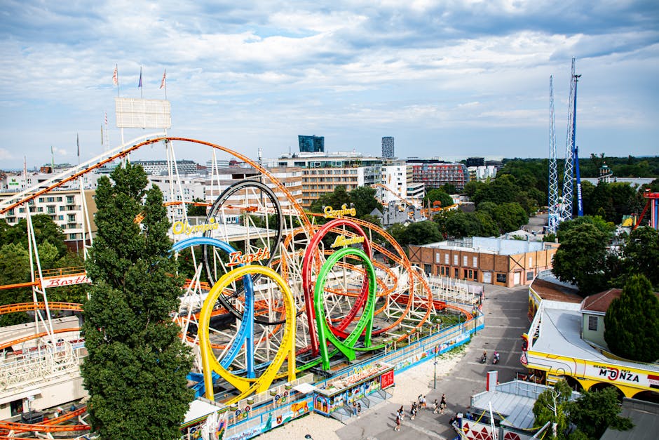 A colorful aerial view of the famous Wurstelprater amusement park in Vienna, Austria, featuring dynamic roller coasters.