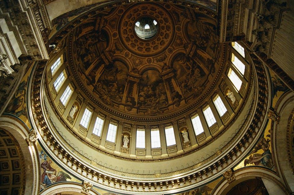 Intricate interior view of St. Paul's Cathedral dome in London, showcasing stunning architectural details.