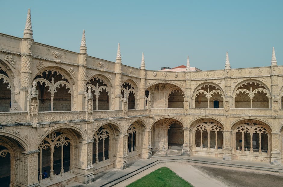 Explore the intricate Gothic architecture of Jerónimos Monastery, a historic landmark in Lisbon, Portugal.