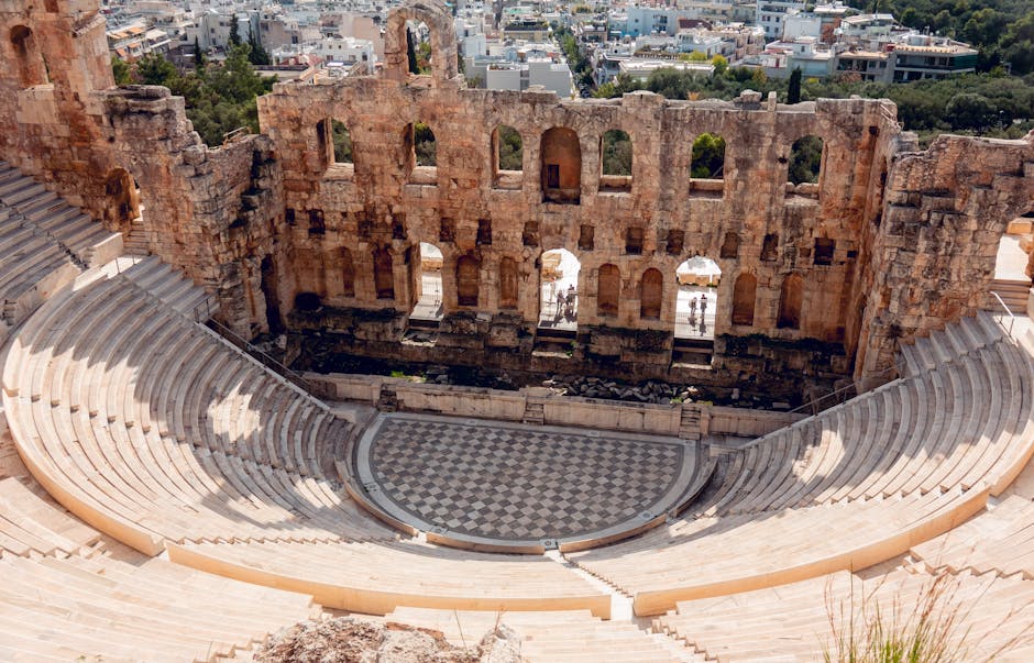 The ancient Odeon of Herodes Atticus amphitheater in Athens during daylight.