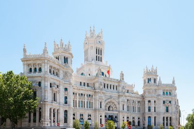 Stunning view of the iconic Palacio de Cibeles, Madrid, under a clear blue sky.