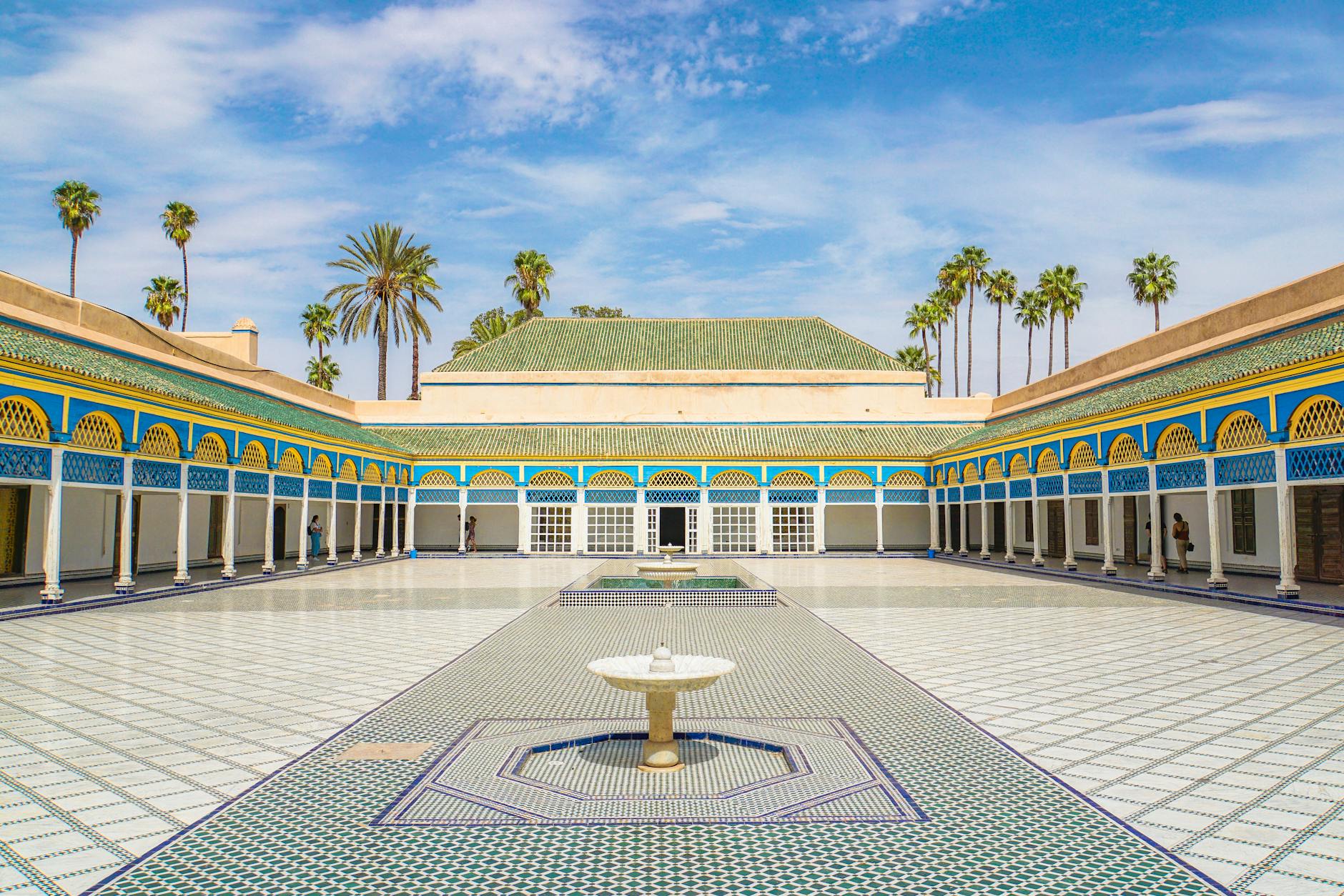 Explore the beautiful courtyard of Bahia Palace in Marrakesh, Morocco, with elegant architecture.