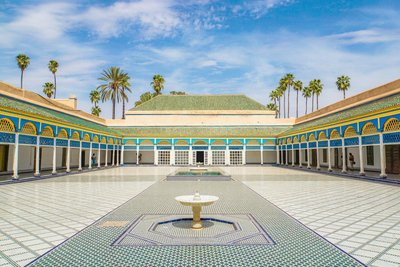Explore the beautiful courtyard of Bahia Palace in Marrakesh, Morocco, with elegant architecture.