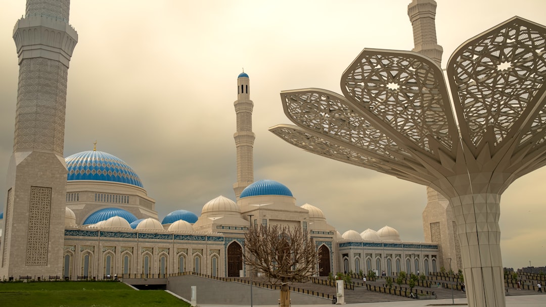 a large white building with a blue dome