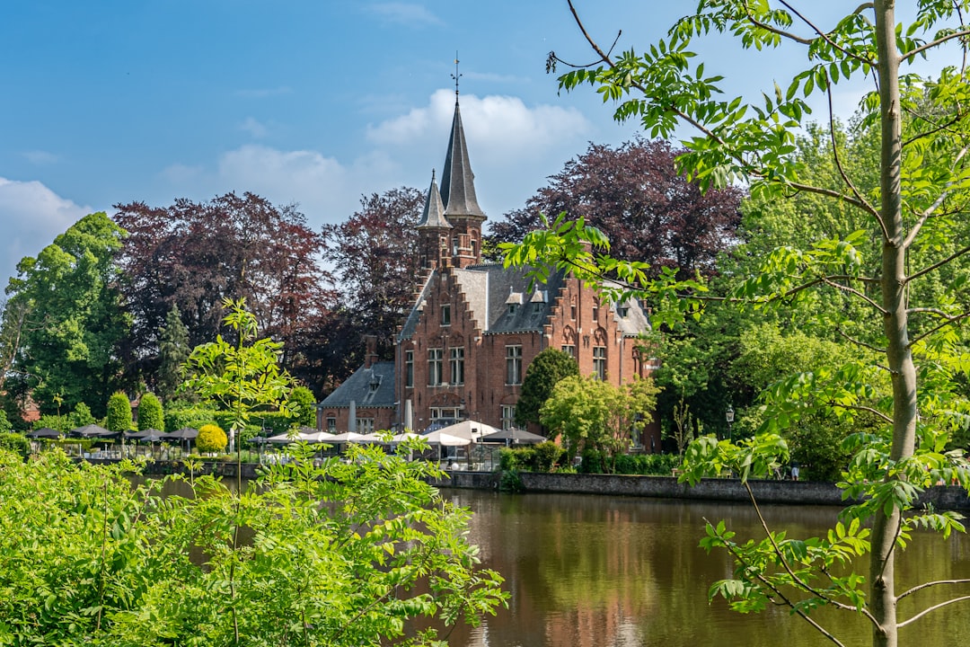 a large building sitting next to a body of water