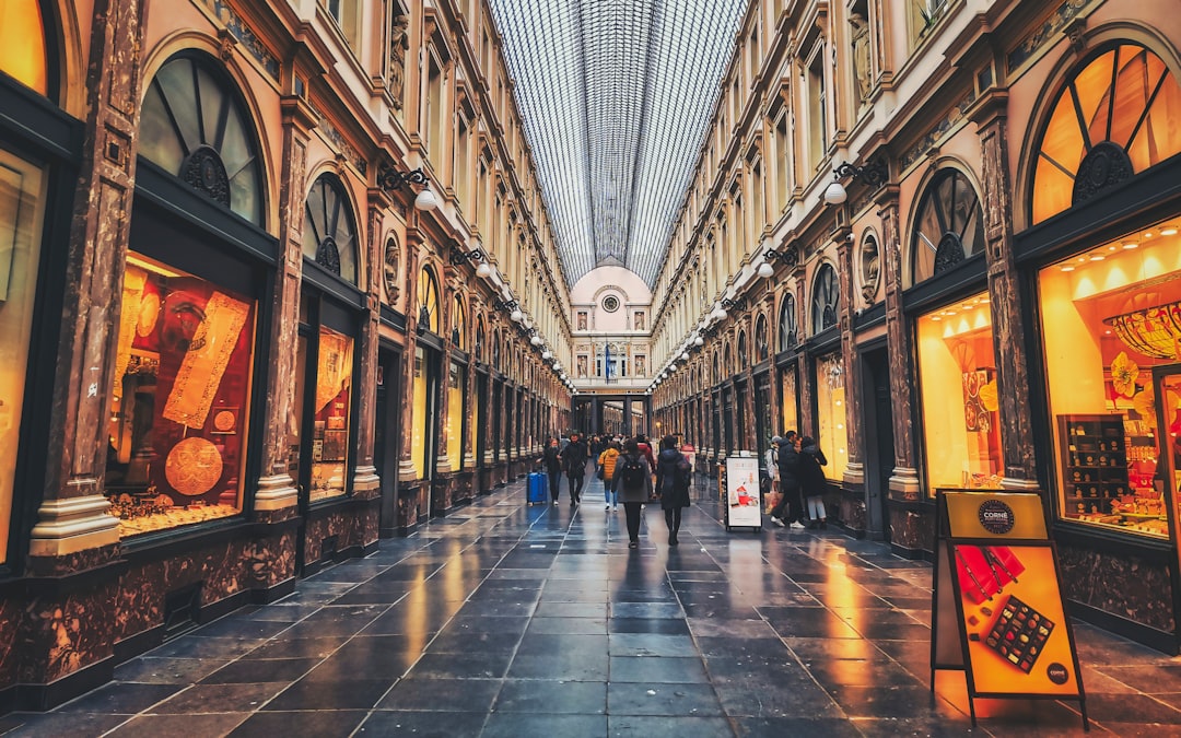a group of people that are walking down a hallway