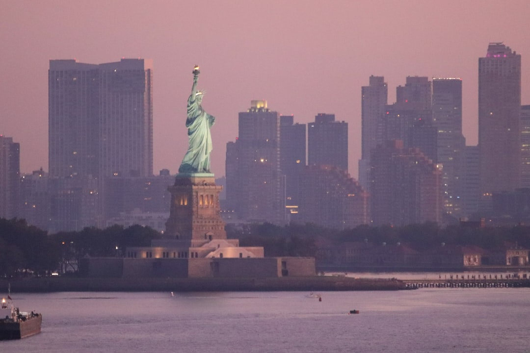 a view of the statue of liberty from across the water