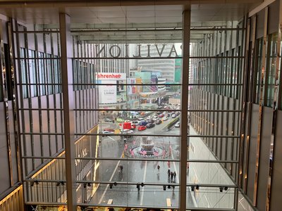 a view of a street through a gate