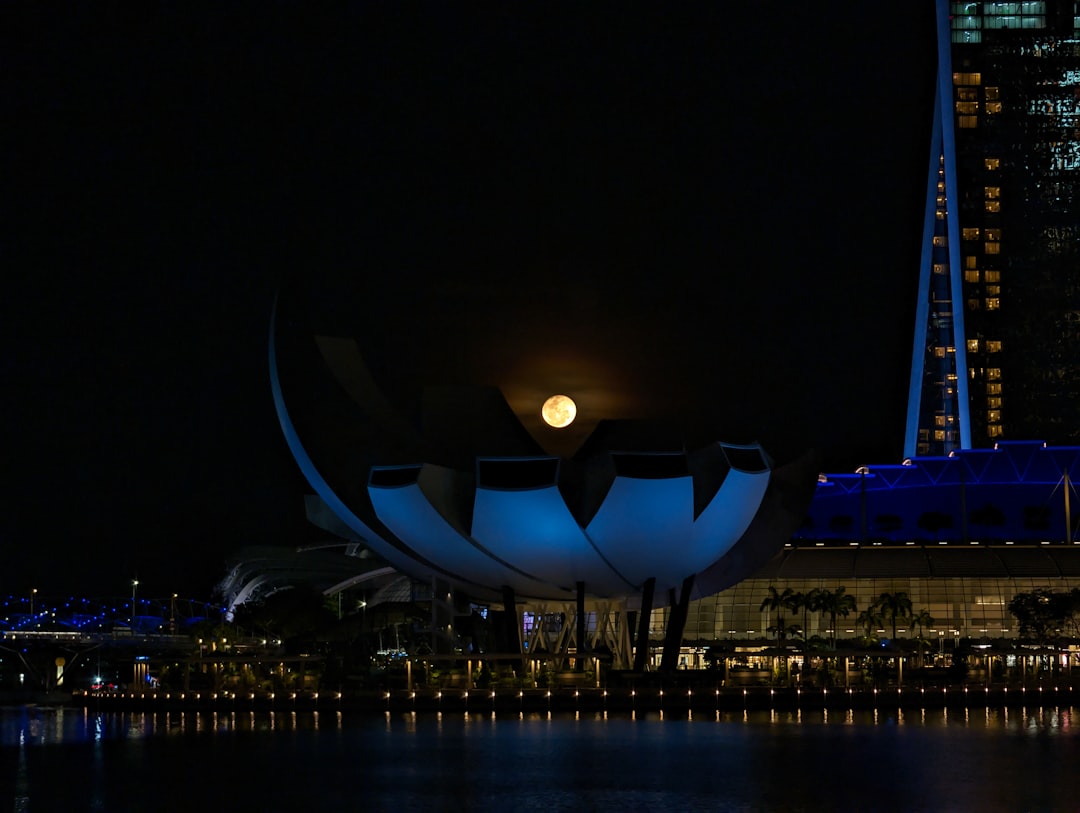 A city skyline at night with a building lit up