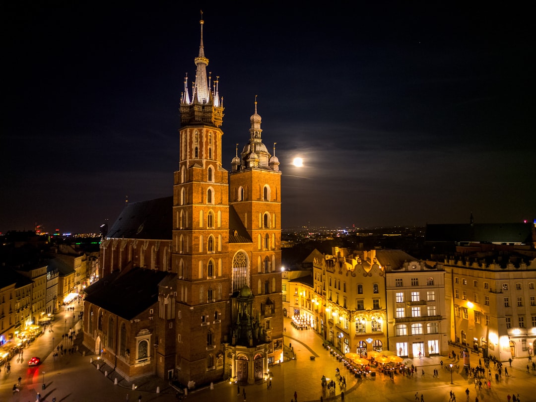a large building with a clock tower at night