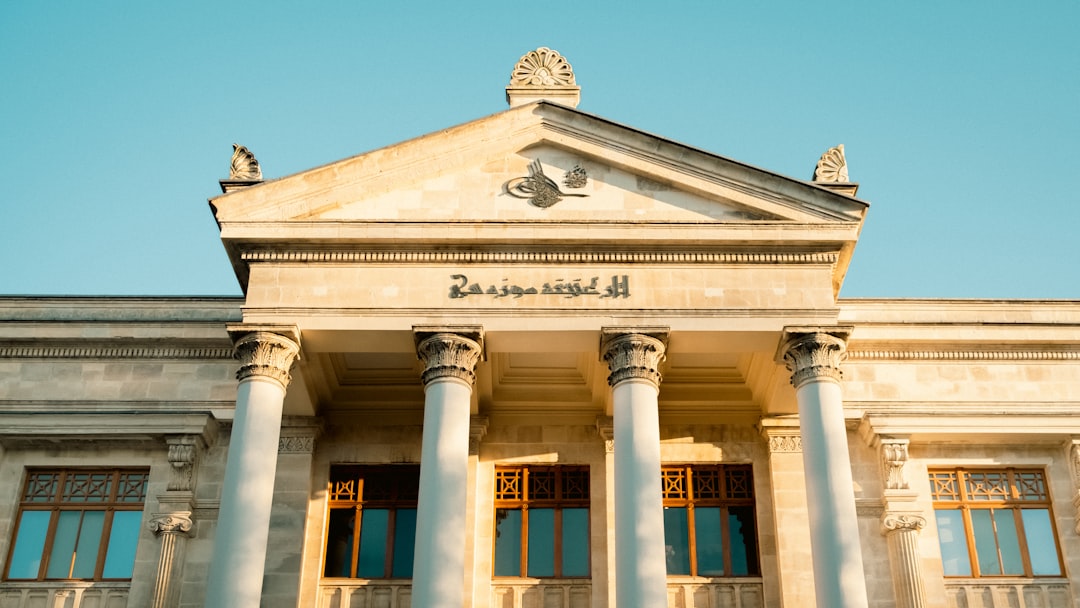 a building with columns and a blue sky