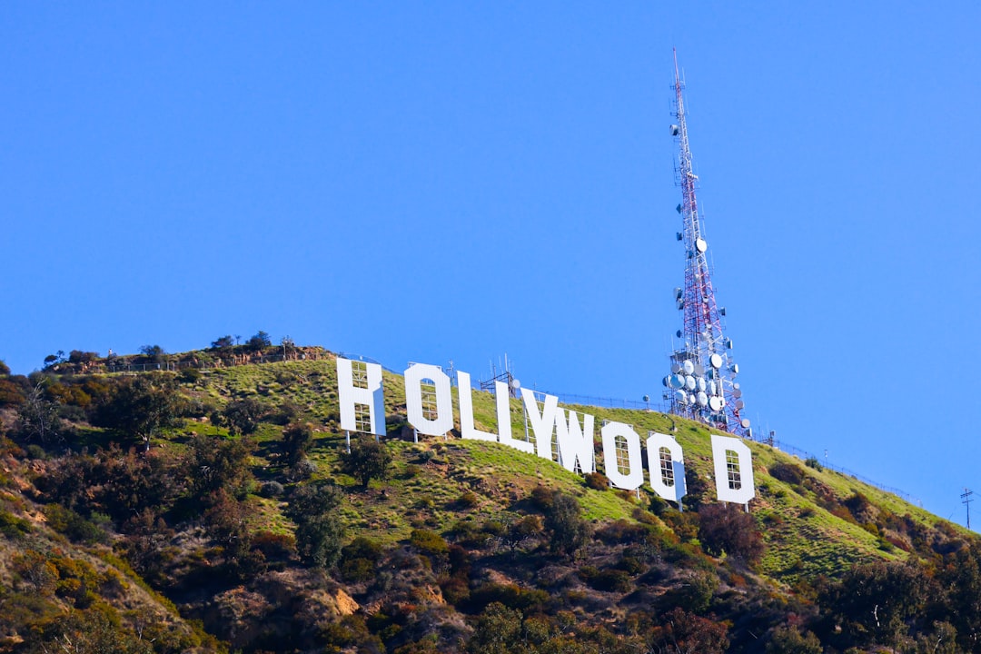 The hollywood sign stands tall on a hillside.