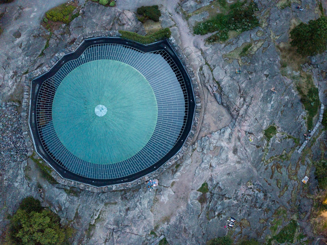 an aerial view of a building with a circular roof