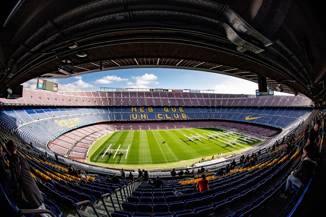 a large stadium with a green field