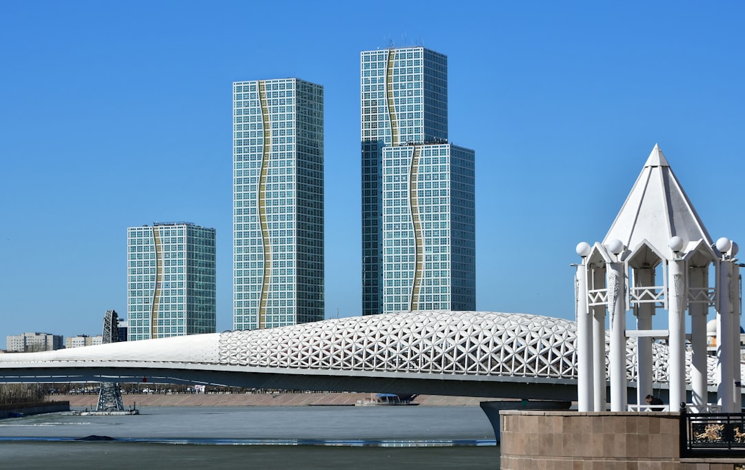 a large white structure sitting in the middle of a body of water