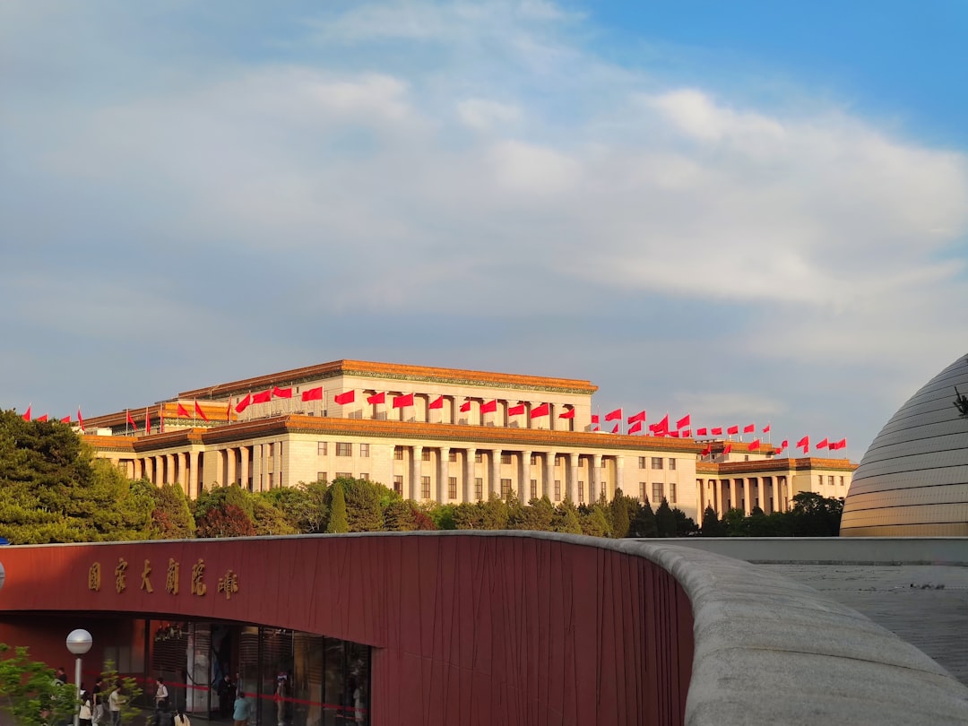 A view of a large building with a red roof