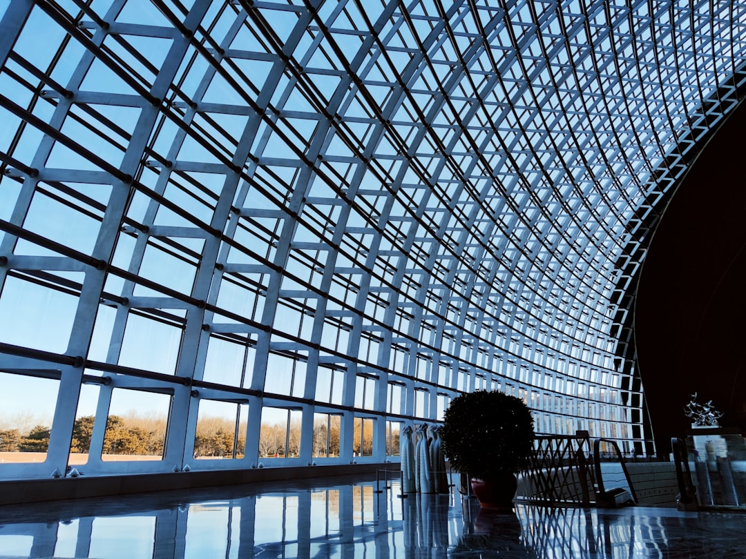 A person standing in front of a large metal structure