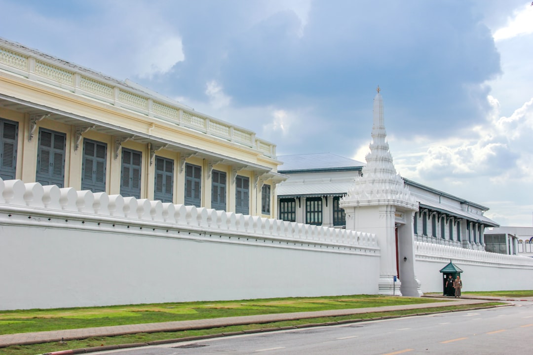 a large white building with a clock on the side of it