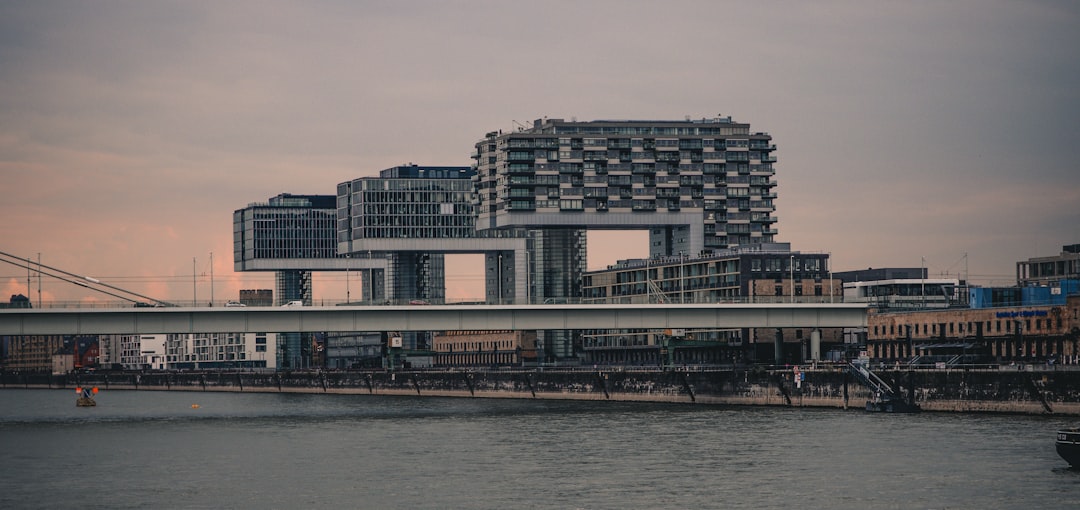 a bridge over water with buildings in the background