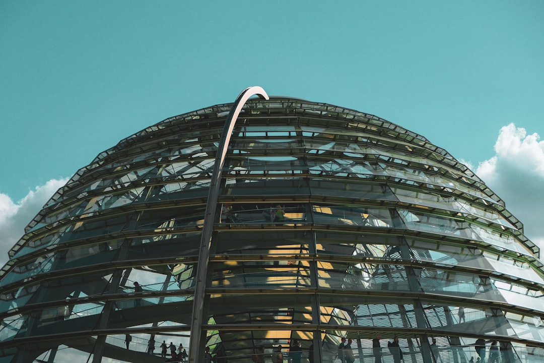 a very tall glass dome with a sky in the background