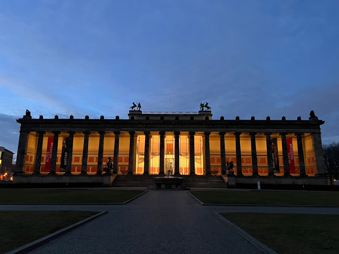 Neoclassical building with illuminated columns at dusk