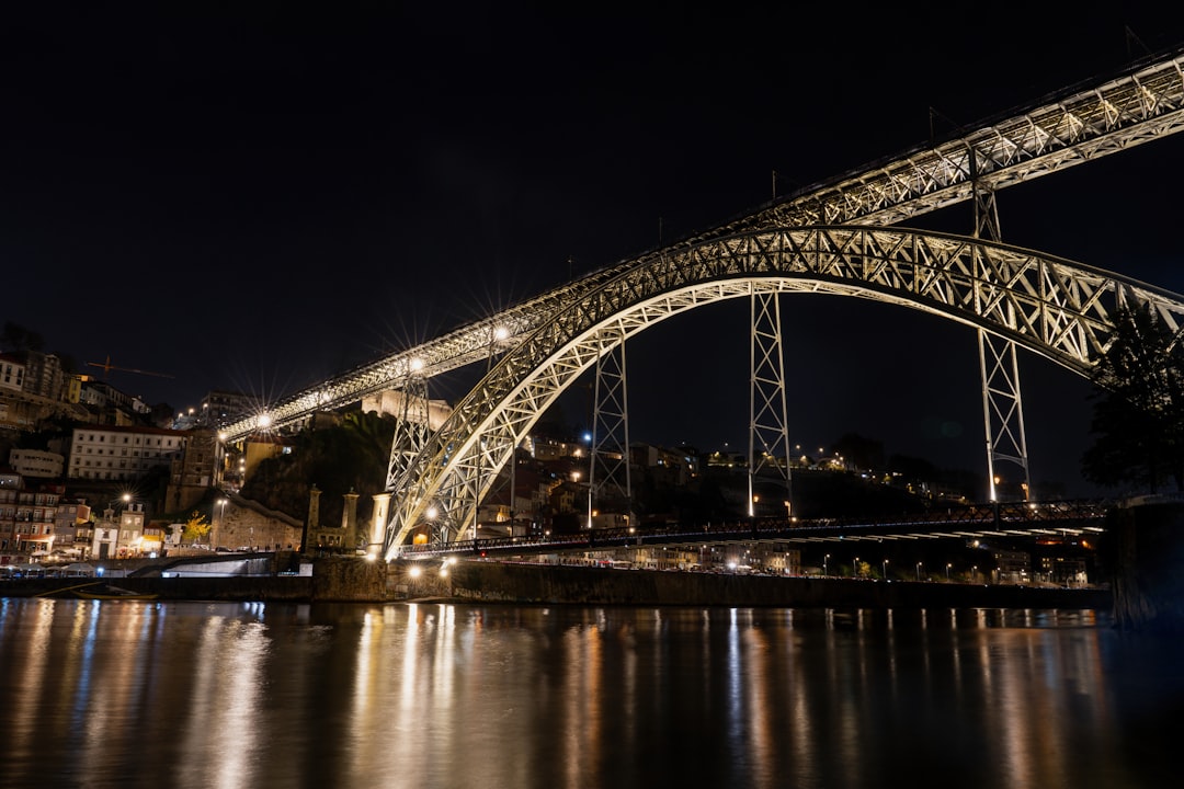 A large bridge over a body of water at night