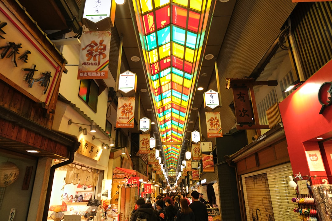 a group of people walking down a long hallway
